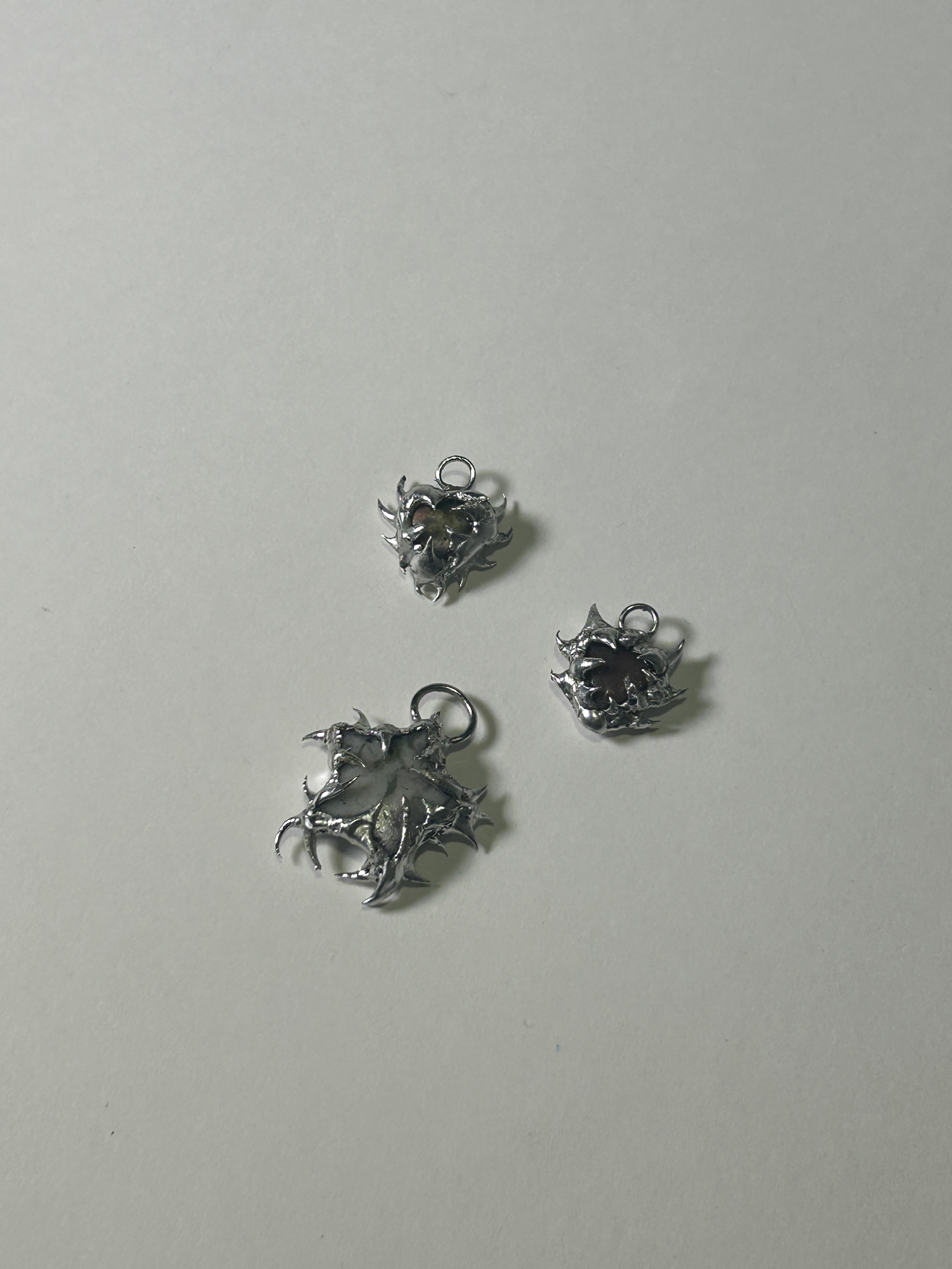 Jewelry design — small metal charms