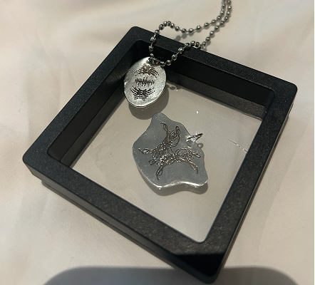 Laser engraved pendants in a frame